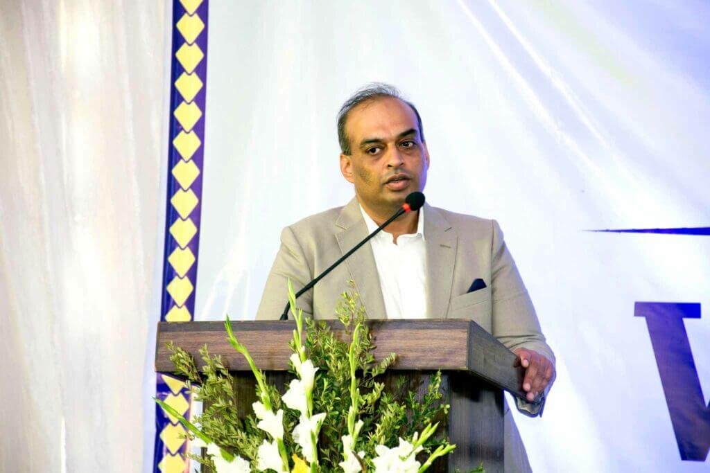 a man giving speech on the stage